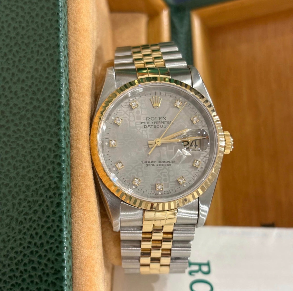 Rolex Datejust 16233 front view of the silver Jubilee Computer dial with factory diamond hour markers and fluted gold bezel