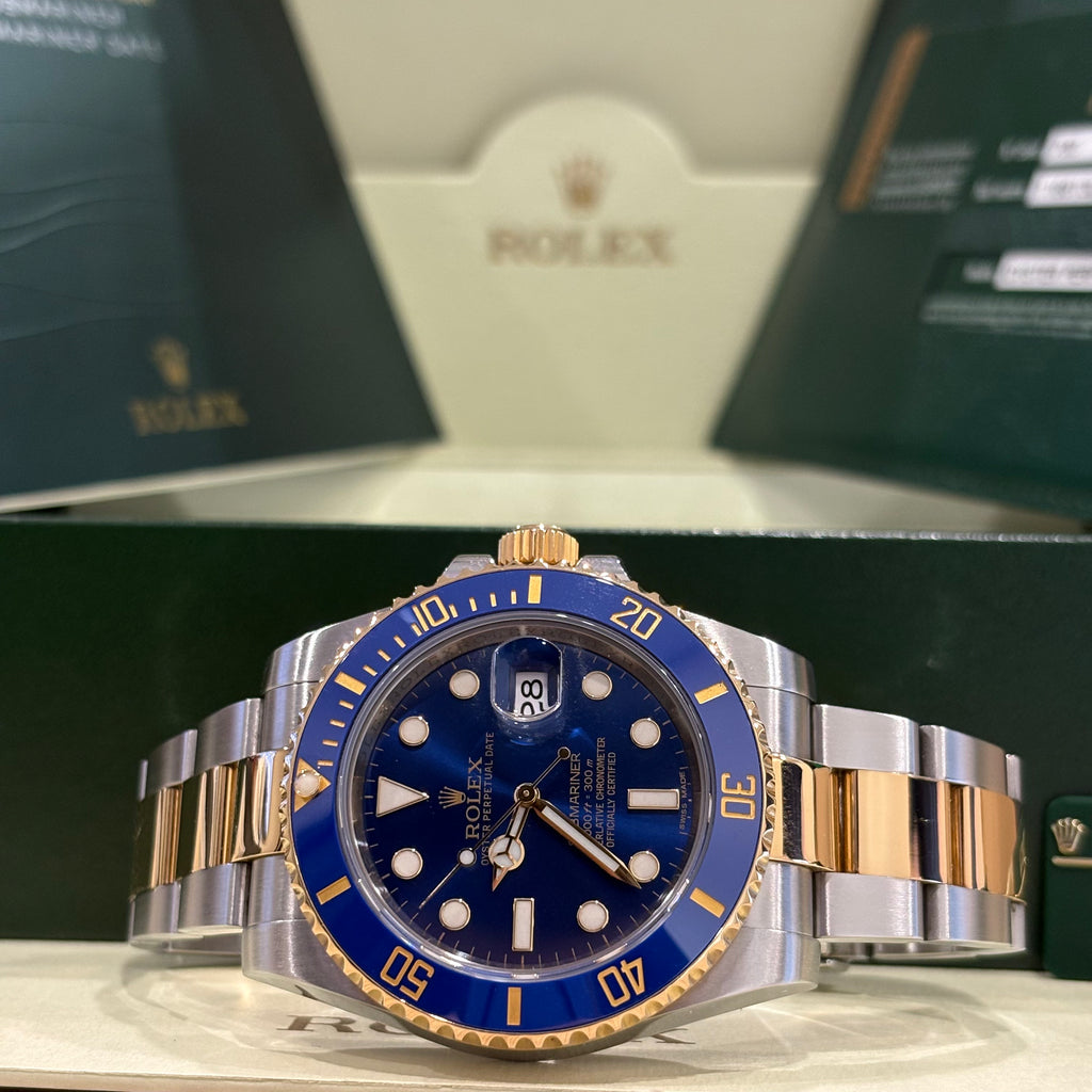 Rolex Submariner Bluesy 116613LB close view of the sunburst blue dial and date Cyclops