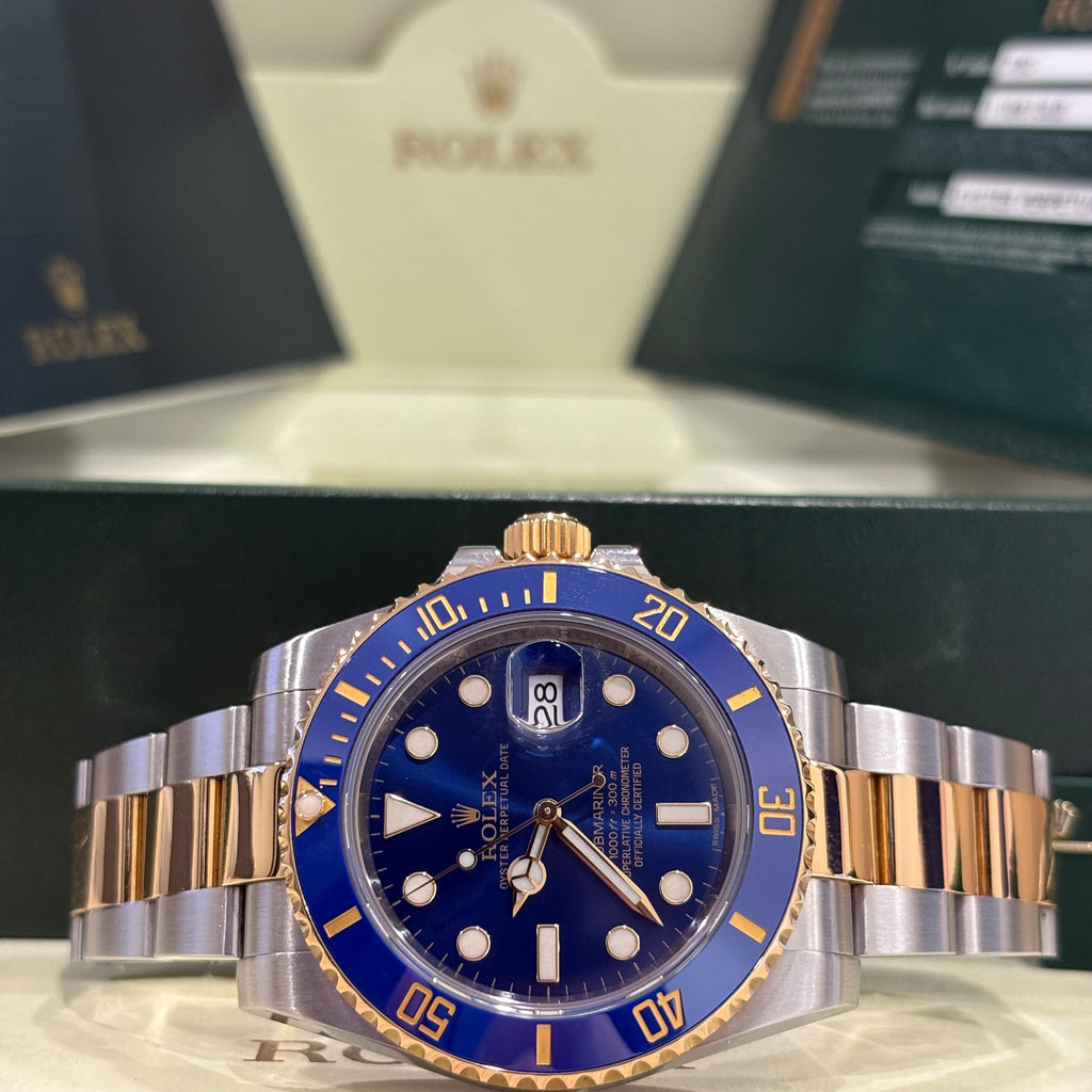Rolex Submariner Date two tone blue dial side on view of the Oyster bracelet with Rolex box behind