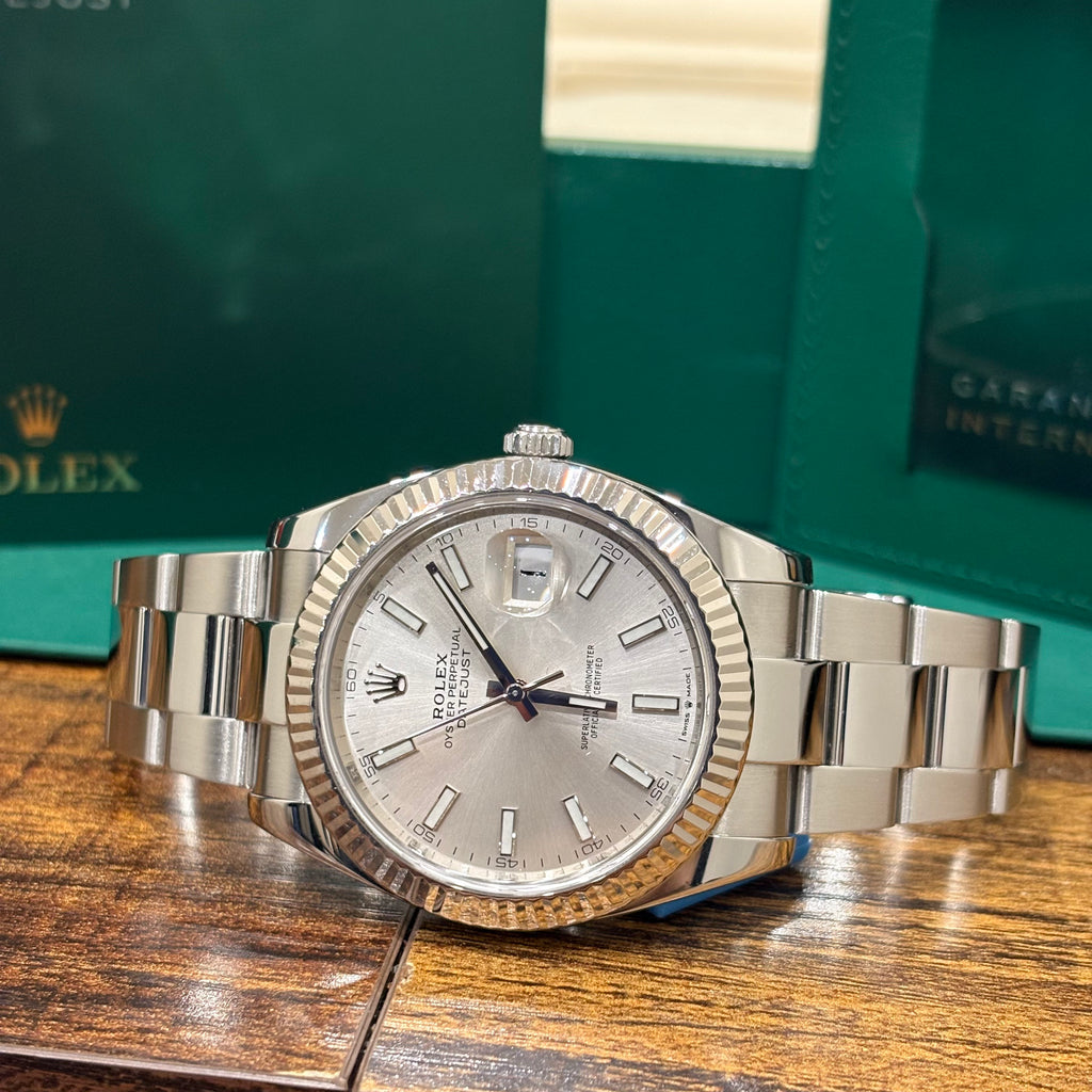 Rolex Datejust 41 126334 silver dial angled close up of the fluted white gold bezel and crown