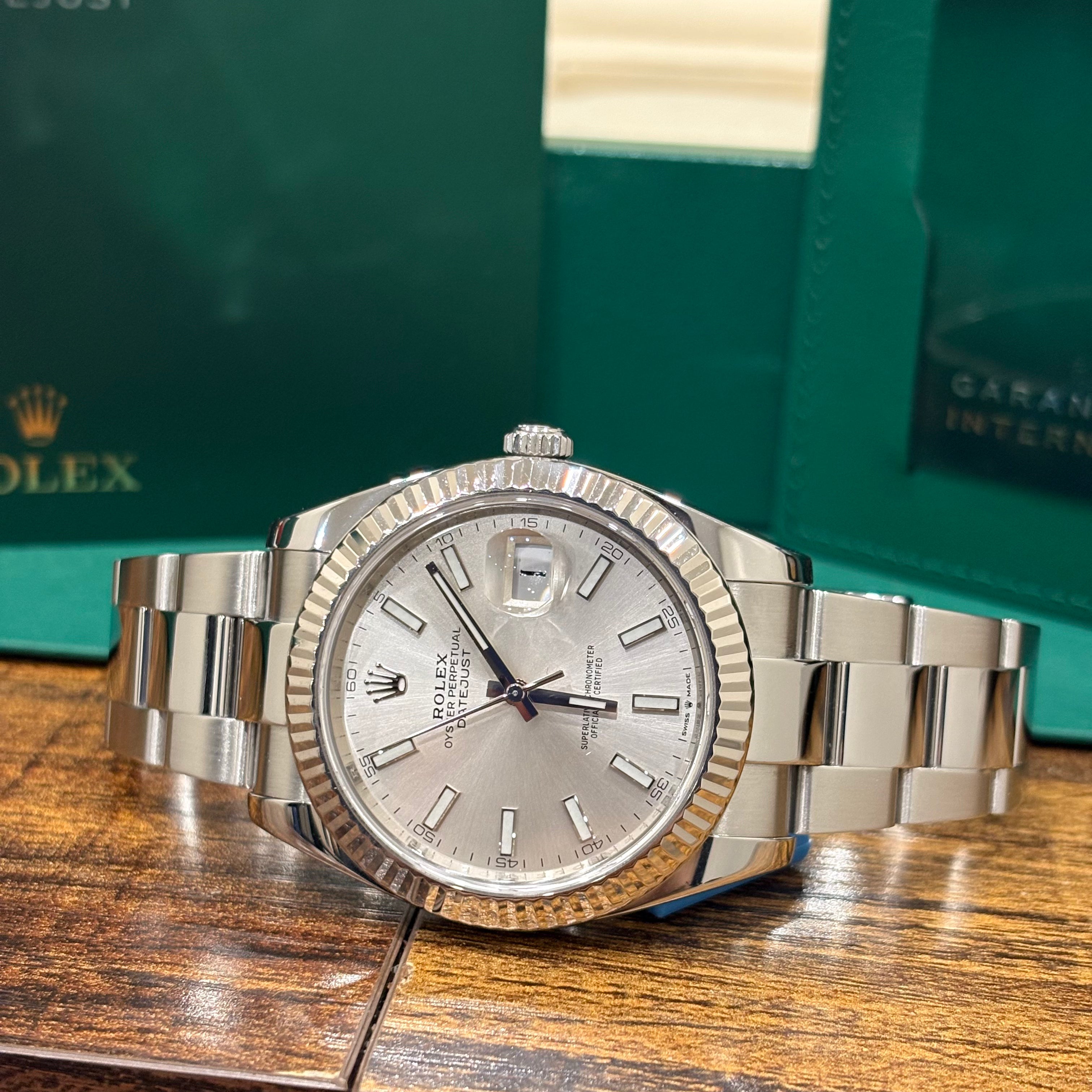 Rolex Datejust 41 126334 silver dial angled close up of the fluted white gold bezel and crown