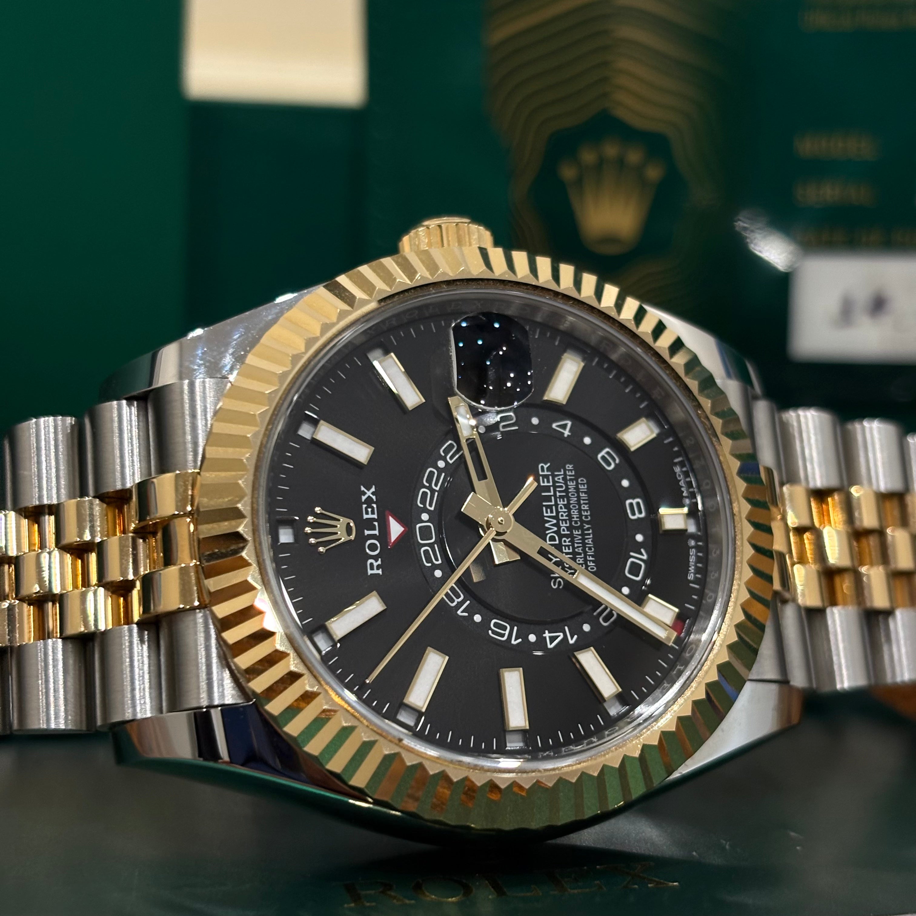 Rolex Sky Dweller two tone black dial close up of the dual time zone disc and date window