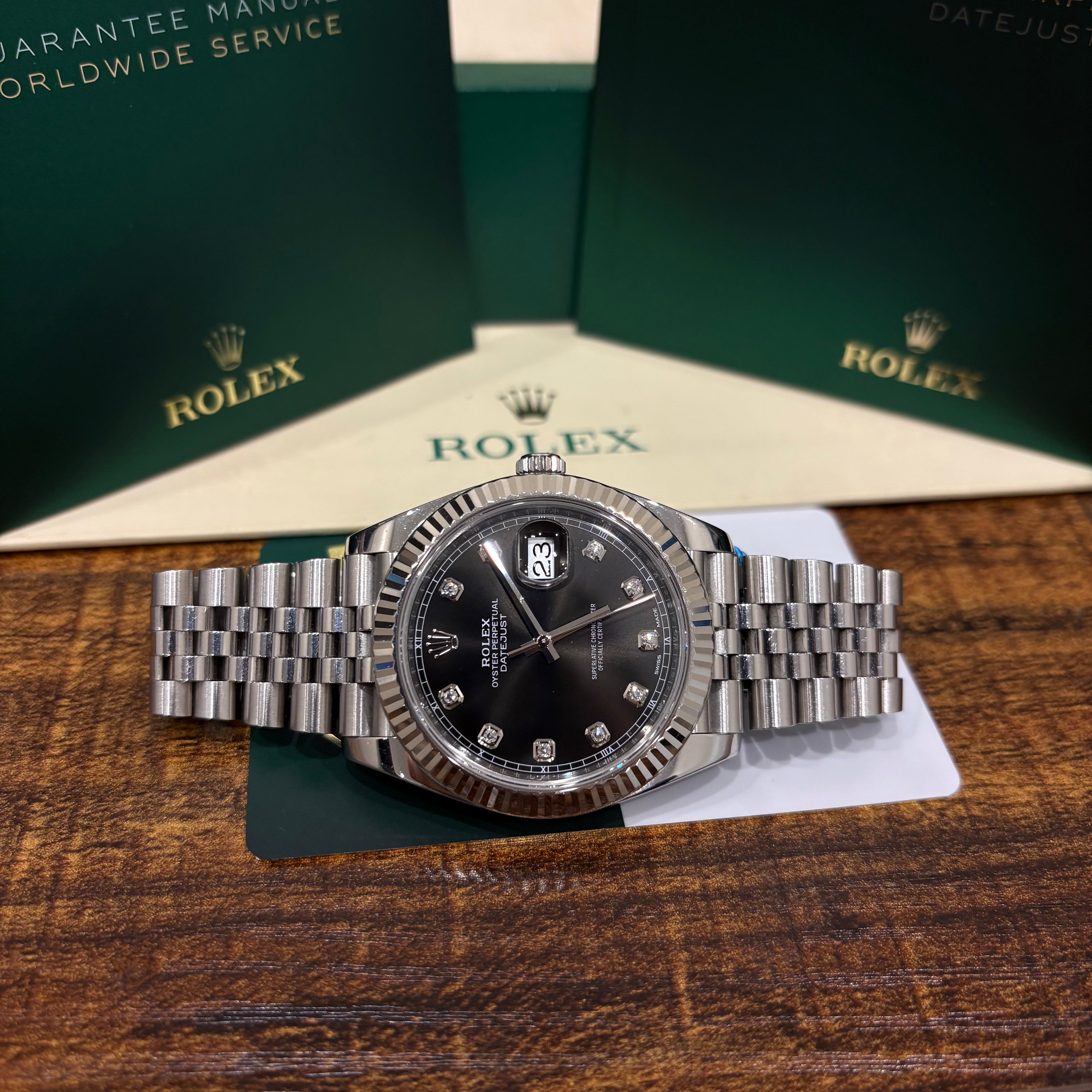 Rolex Datejust 41 126334 black diamond dial with Rolex box and booklets in the background