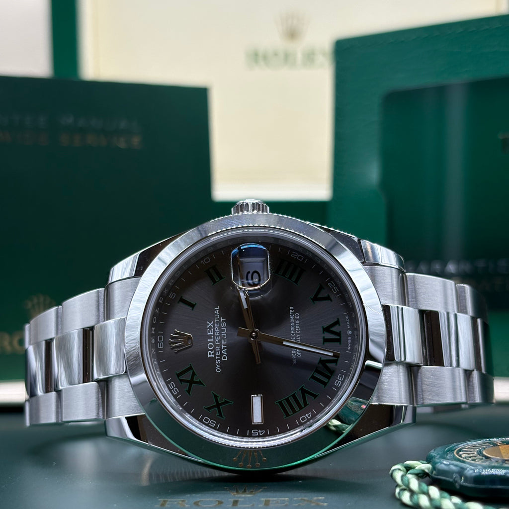 Brand new 2026 Rolex Datejust 41 ref 126300 Wimbledon slate dial with smooth bezel on Oyster bracelet, laid in front of its Rolex box at Adonia Jewellers in Yorkville, Toronto
