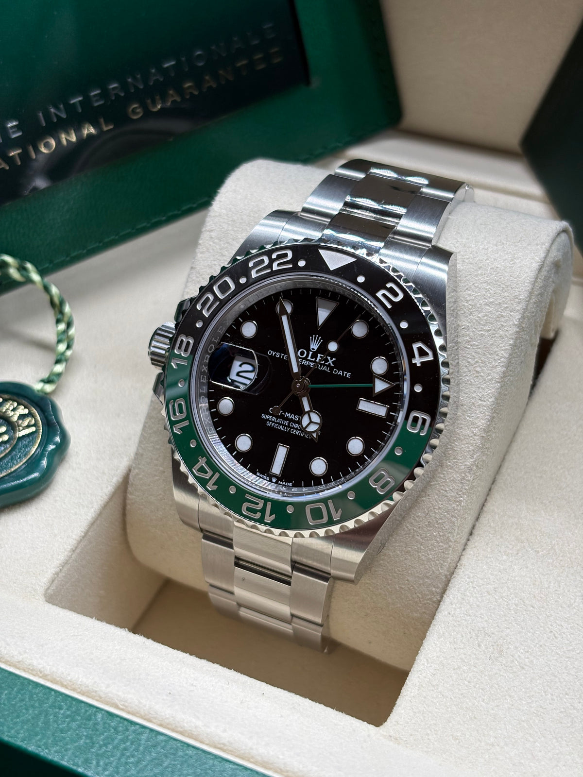 Rolex GMT Master II Sprite Oyster angled view showing the date Cyclops and left side crown