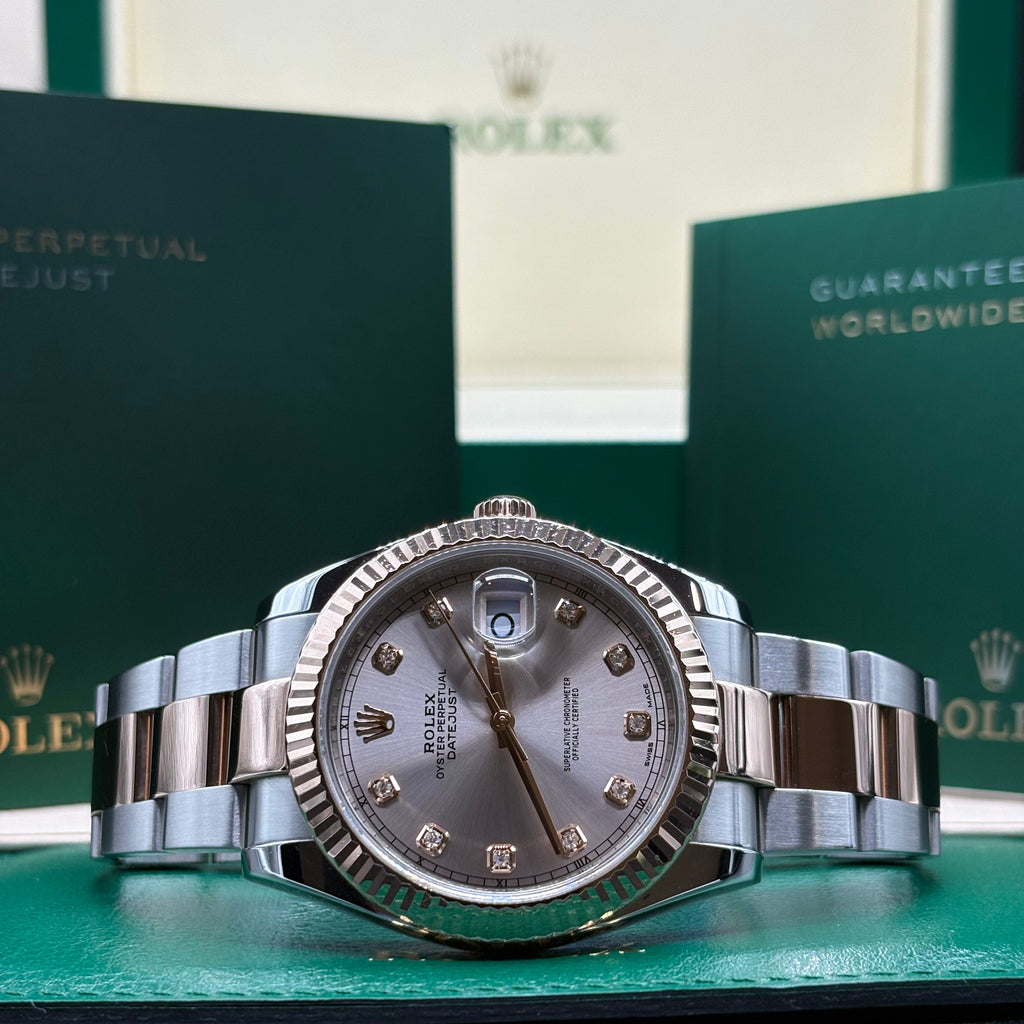 Rolex Datejust 41mm two tone Everose gold sundust diamond dial with fluted bezel on Oyster bracelet, laid in front of its Rolex box at Adonia Jewellers in Yorkville, Toronto
