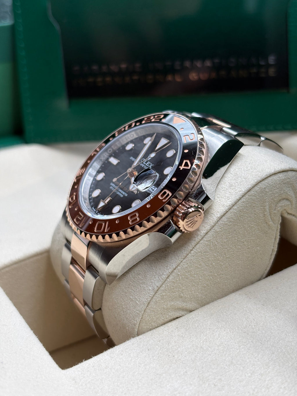 Rolex GMT Master II Root Beer side view showing the Everose gold winding crown