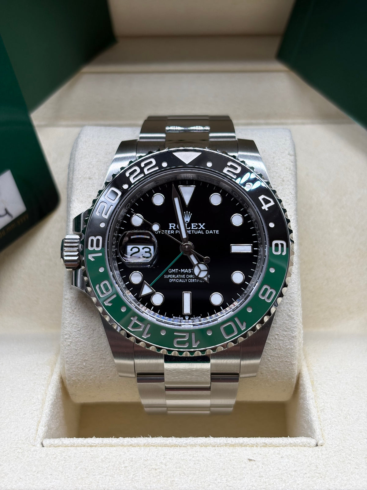Rolex GMT Master II Sprite front view of the black dial with green GMT hand and green and black Cerachrom bezel