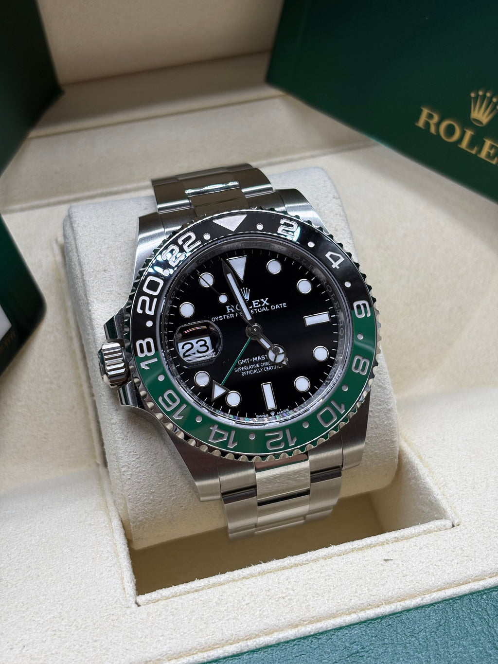 Rolex GMT Master II Sprite Oyster angled view showing the left side crown and date Cyclops