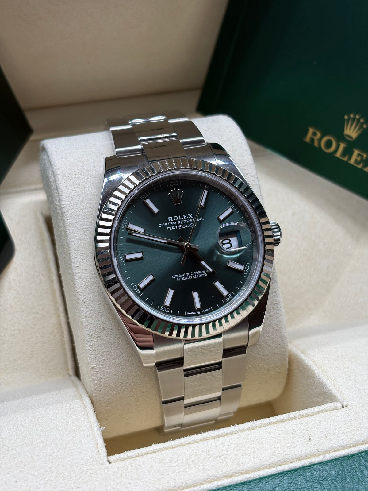 Rolex Datejust 41mm mint green dial front view with index markers, date window and Cyclops lens