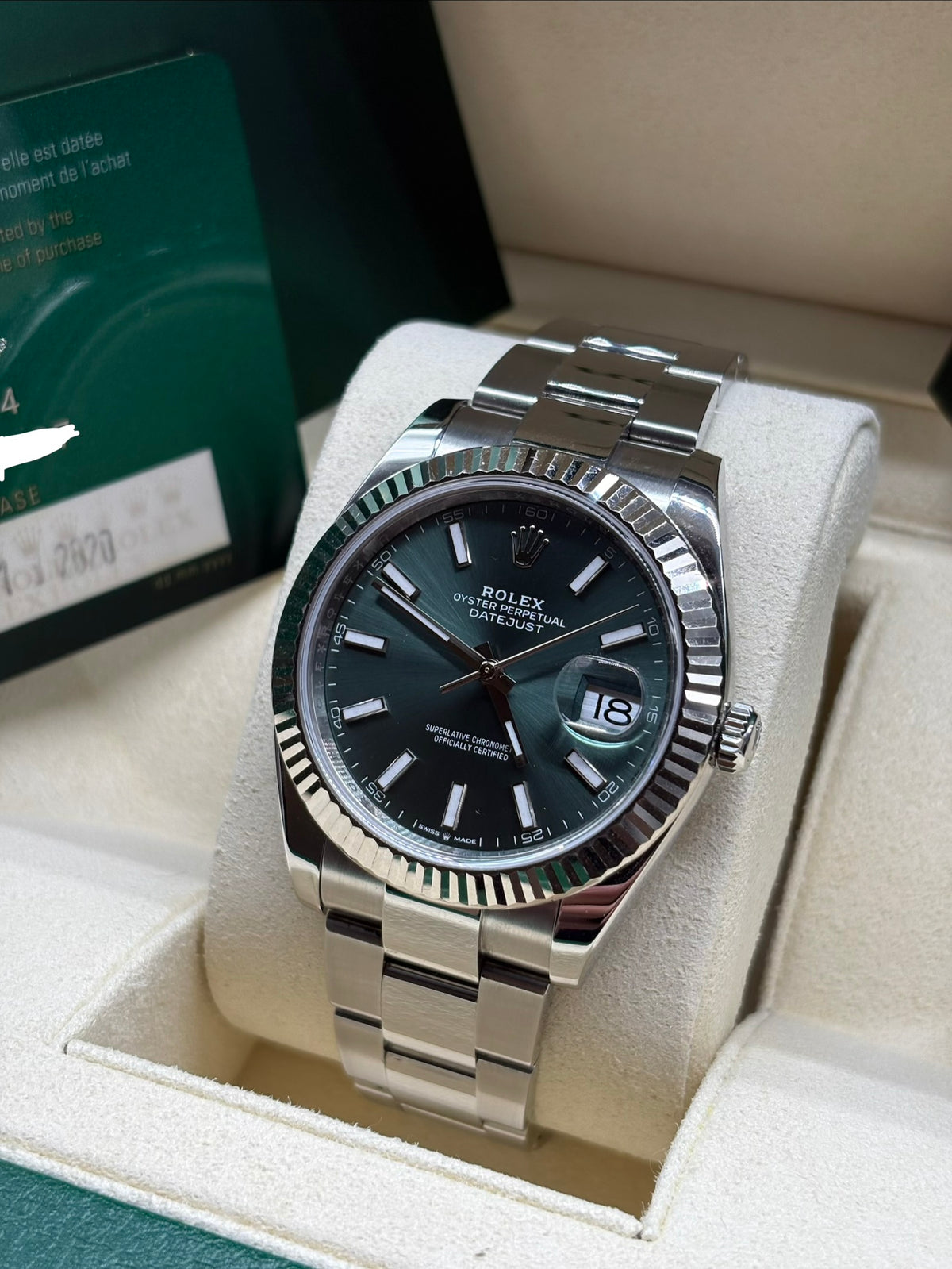 Rolex Datejust 41 mint green dial angled view of the 18K white gold fluted bezel
