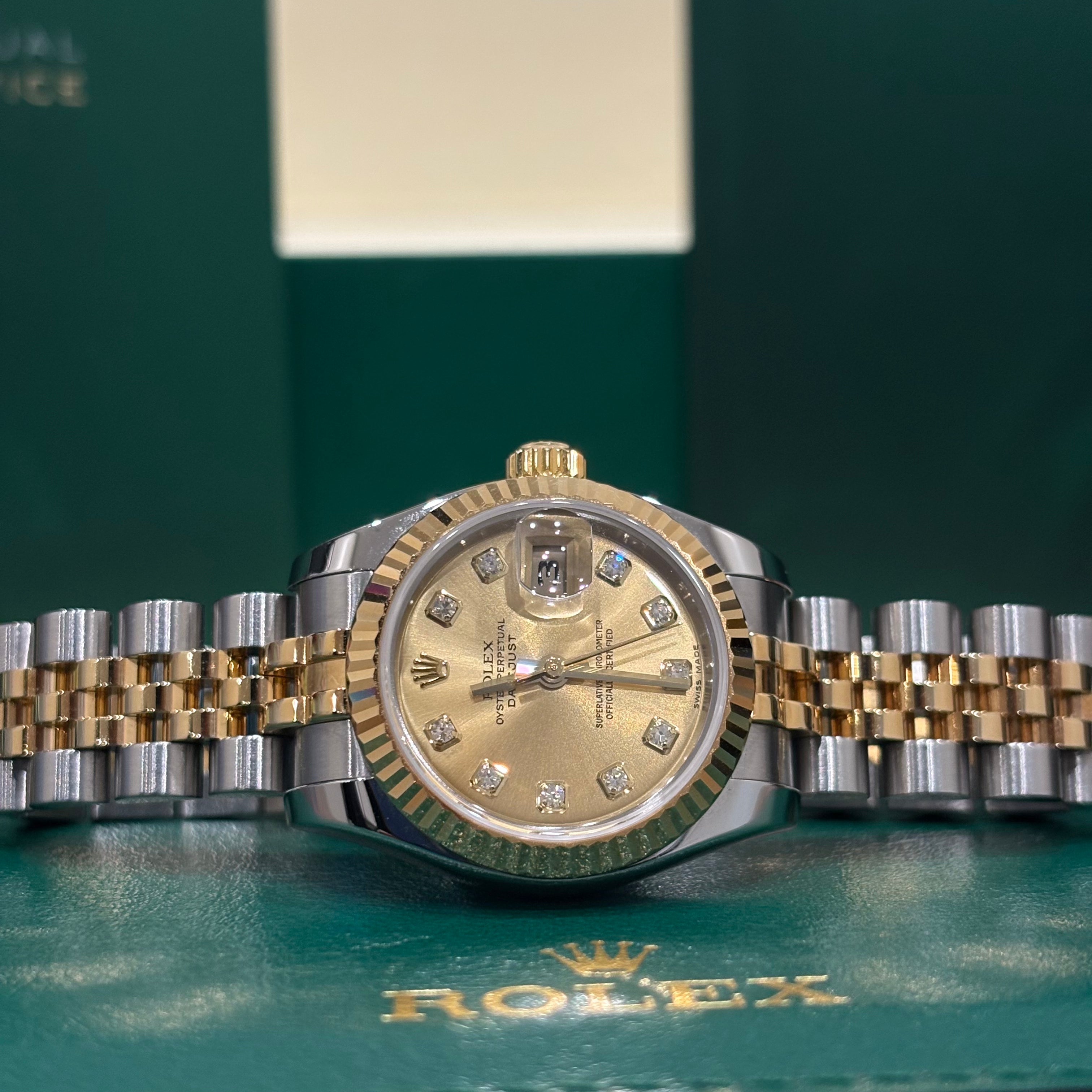 Rolex Datejust 26 179173 close view of the champagne diamond dial and date Cyclops