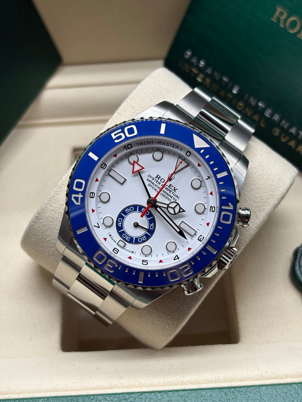 Rolex Yacht Master II 44mm laid on its cushion showing the blue 60 minute graduated bezel