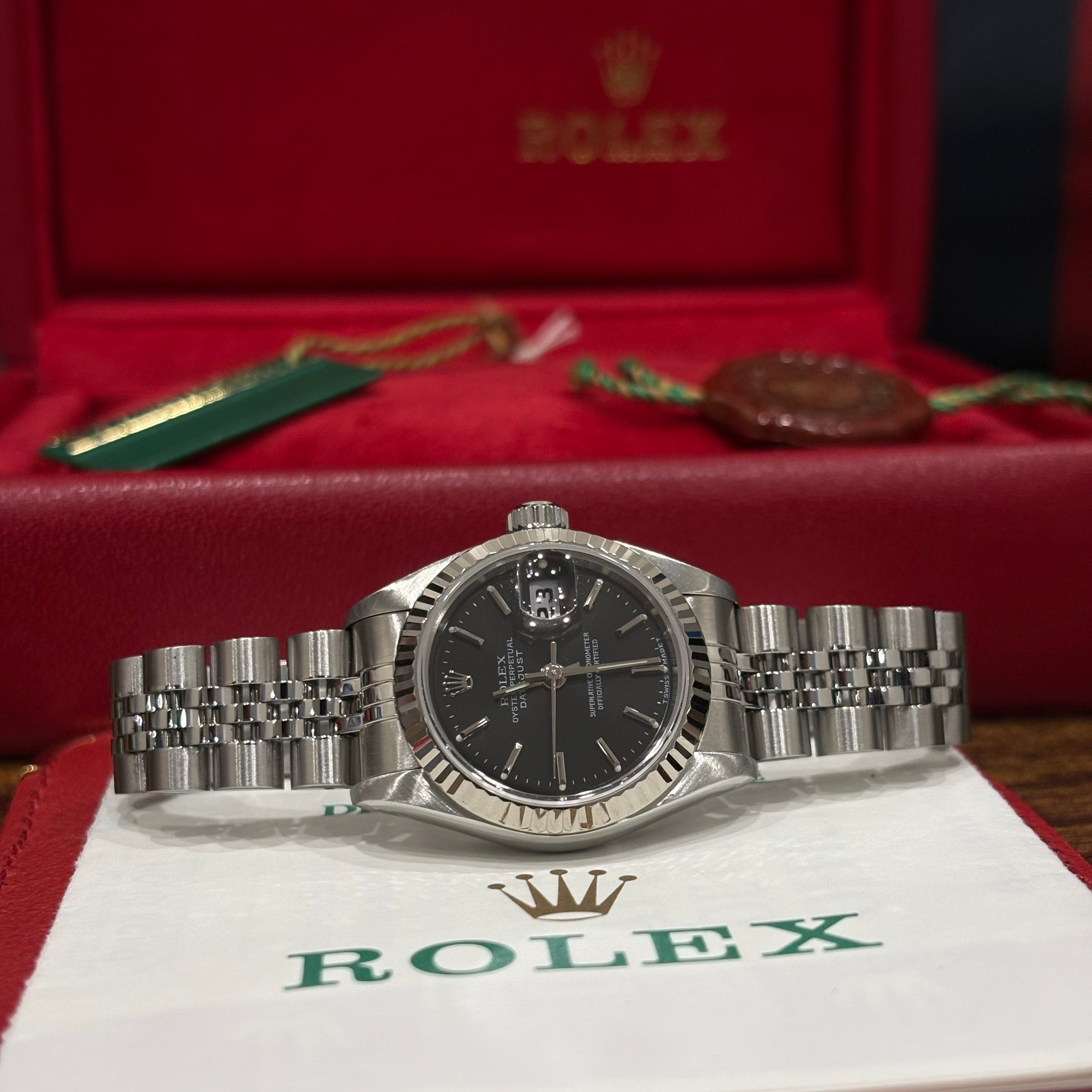 Rolex Lady Datejust 69174 black dial side on view with its vintage red Rolex box and green hang tags