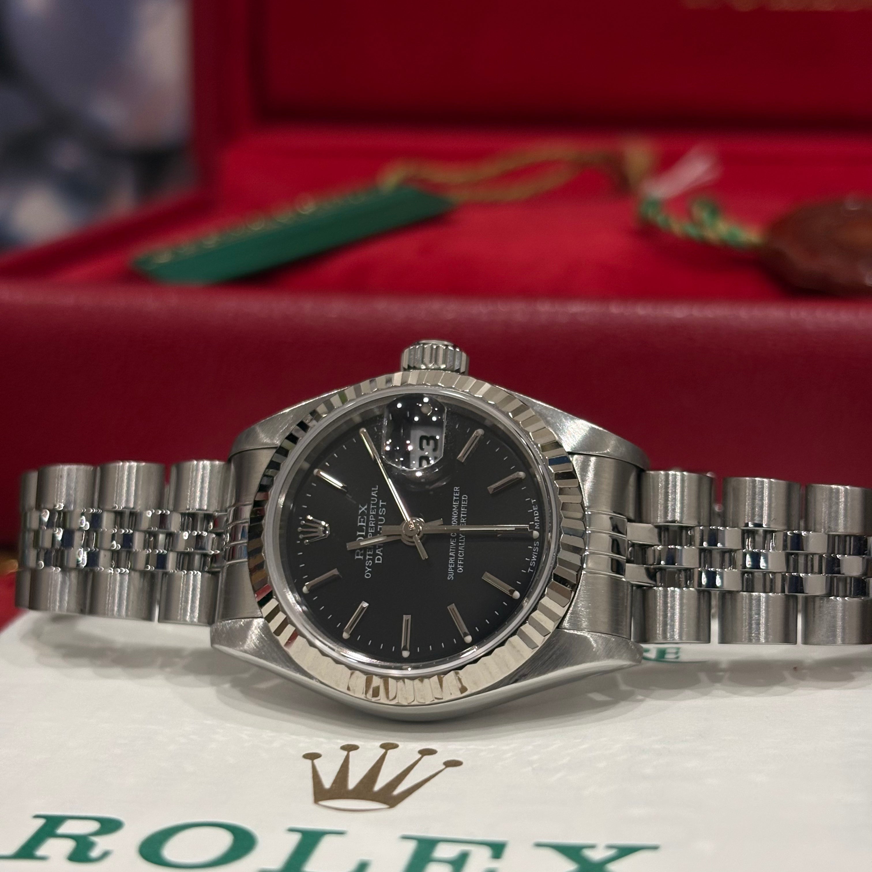 Rolex Datejust 26 69174 black dial angled close view showing the date Cyclops and crown