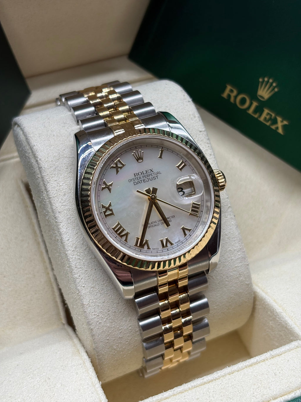 Rolex Datejust 36 mother of pearl Roman dial angled view on its cushion in the Rolex box