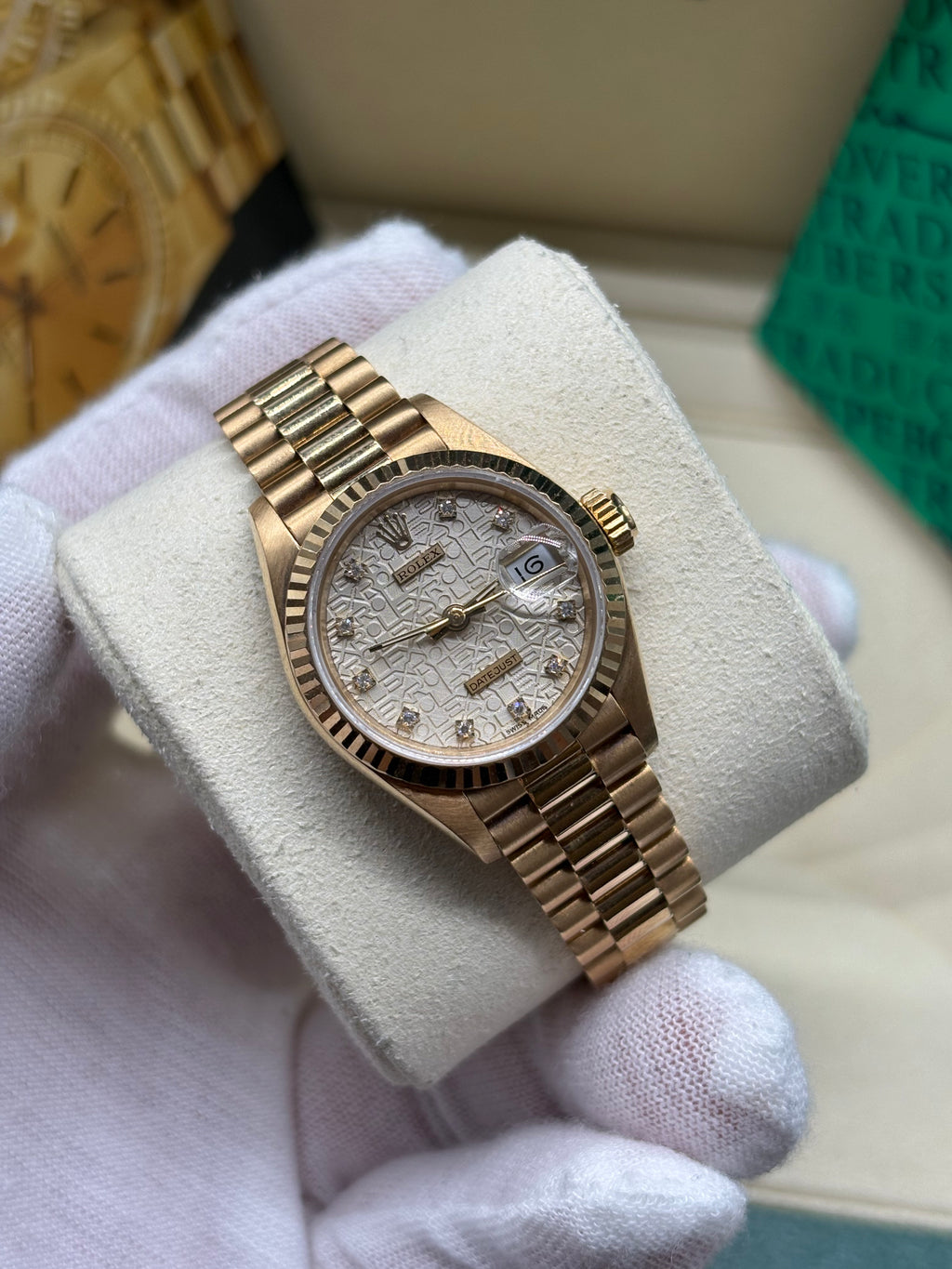 Rolex Lady Datejust 26 silver Computer dial held in a white gloved hand