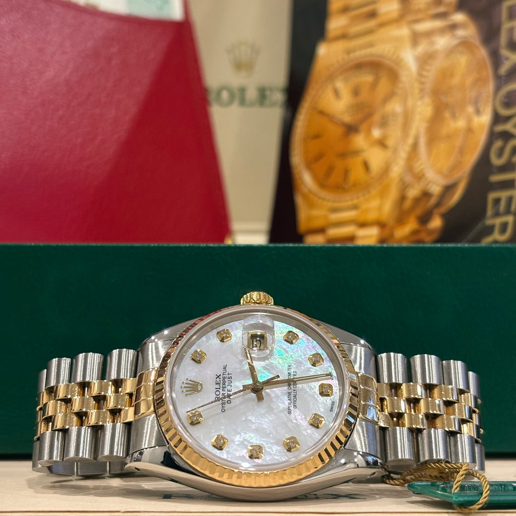 Rolex Datejust 36 two tone mother of pearl dial angled close up of the yellow gold crown