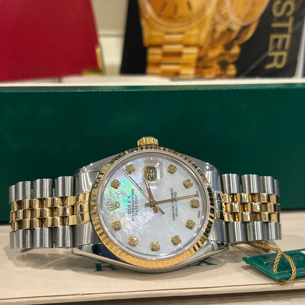 Rolex Datejust 16013 close view of the mother of pearl dial, fluted yellow gold bezel and date Cyclops