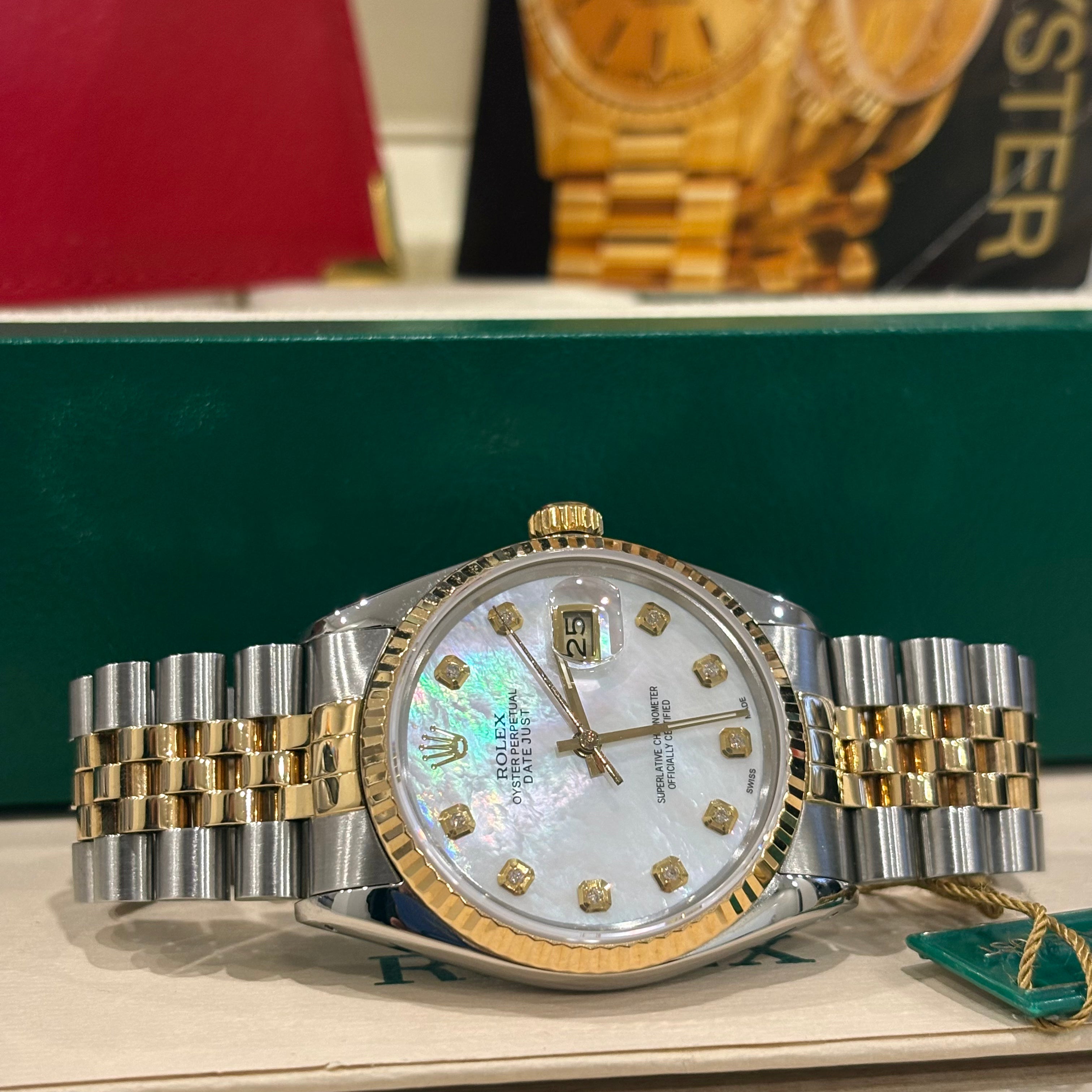 Rolex Datejust 36 mother of pearl diamond dial wide view with green Rolex hang tag