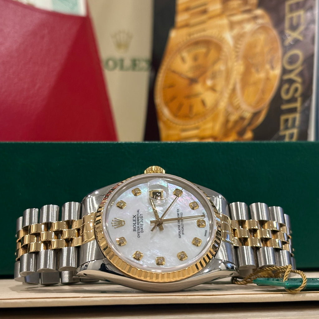 Rolex Datejust 36 ref 16013 two tone white mother of pearl diamond dial laid in front of its Rolex box at Adonia Jewellers in Yorkville, Toronto