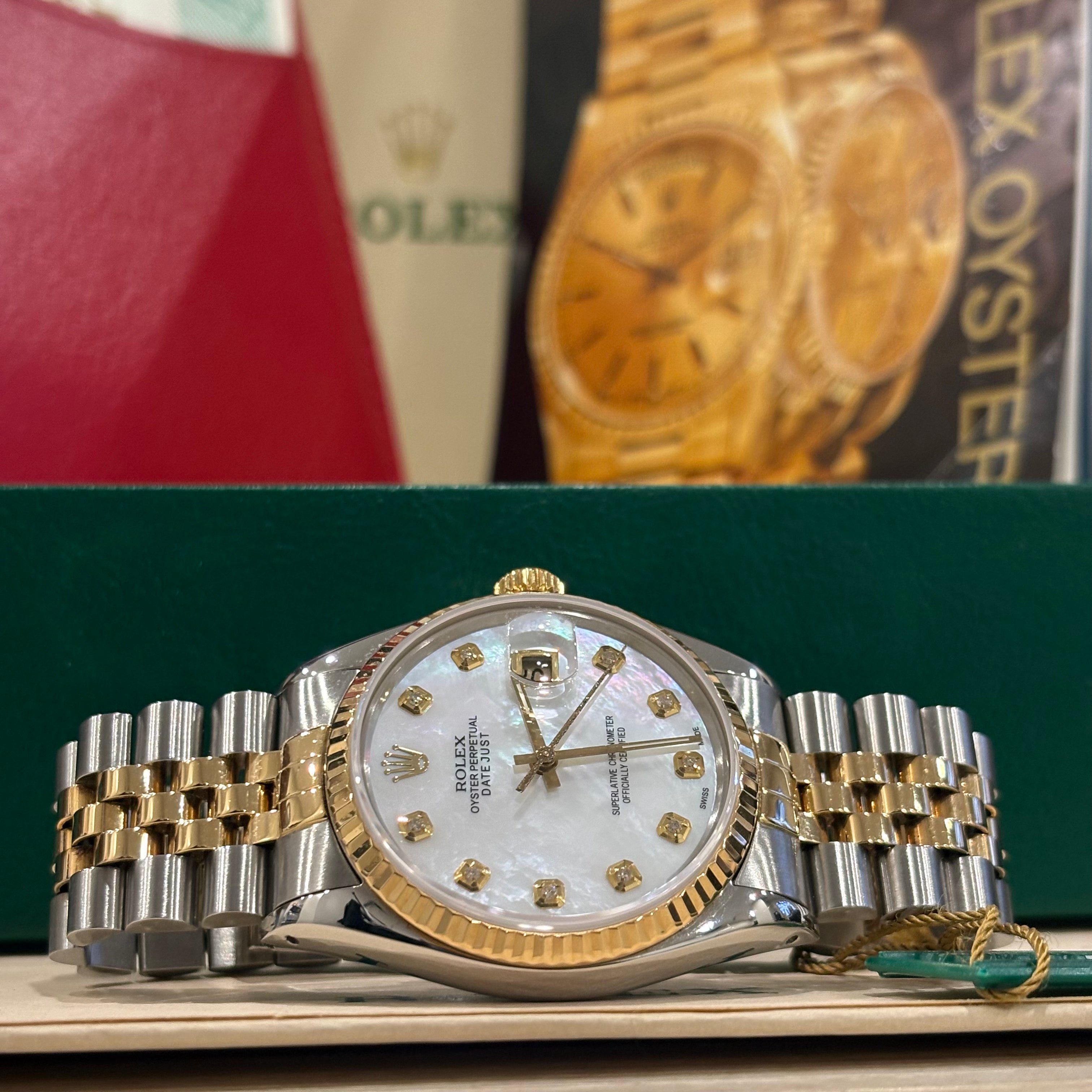 Rolex Datejust 36 ref 16013 two tone white mother of pearl diamond dial laid in front of its Rolex box at Adonia Jewellers in Yorkville, Toronto