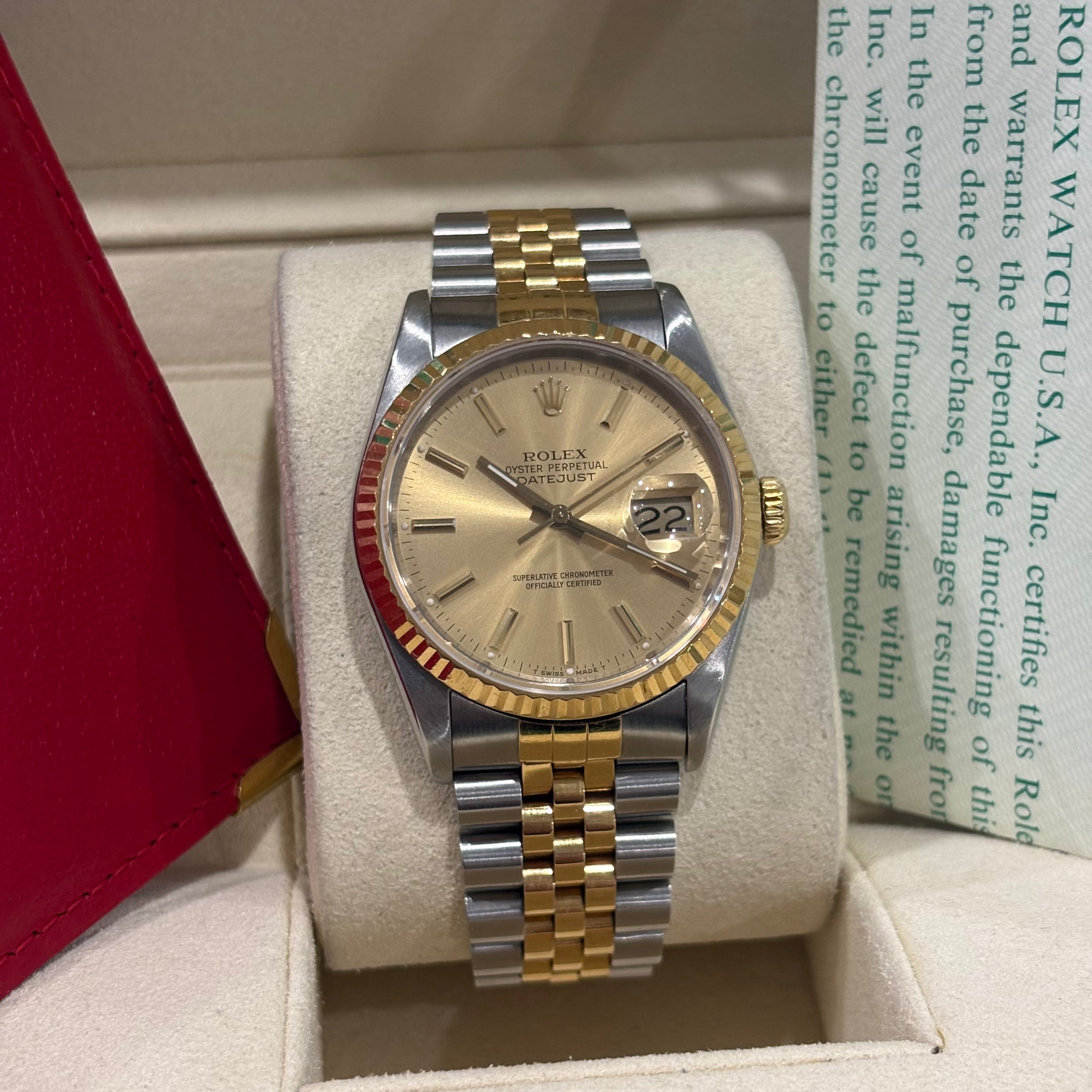 Rolex Datejust 36 16233 close view of the champagne sunburst dial, stick markers and date Cyclops