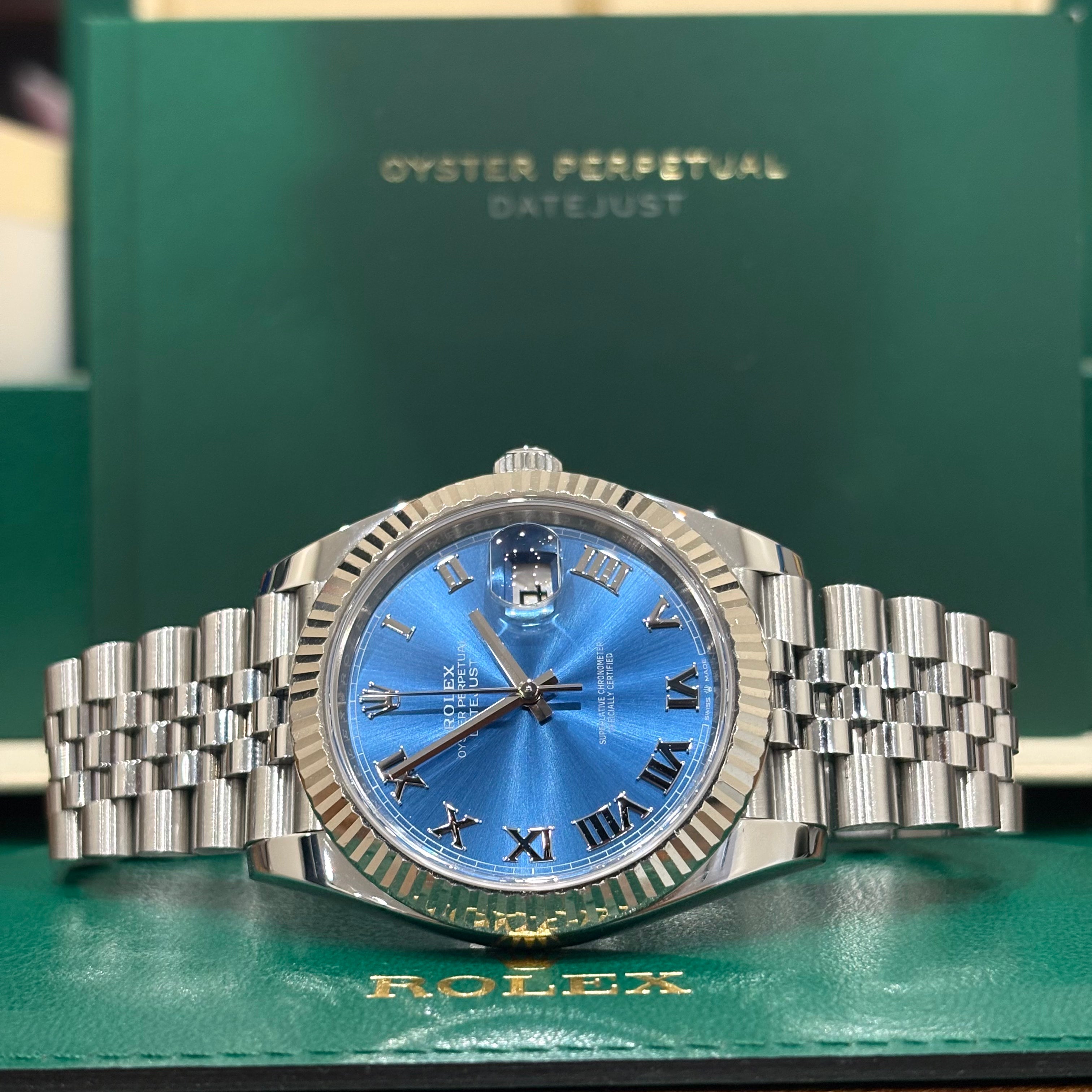Rolex Datejust 41 blue Roman dial close view of the silver Roman numerals and date Cyclops