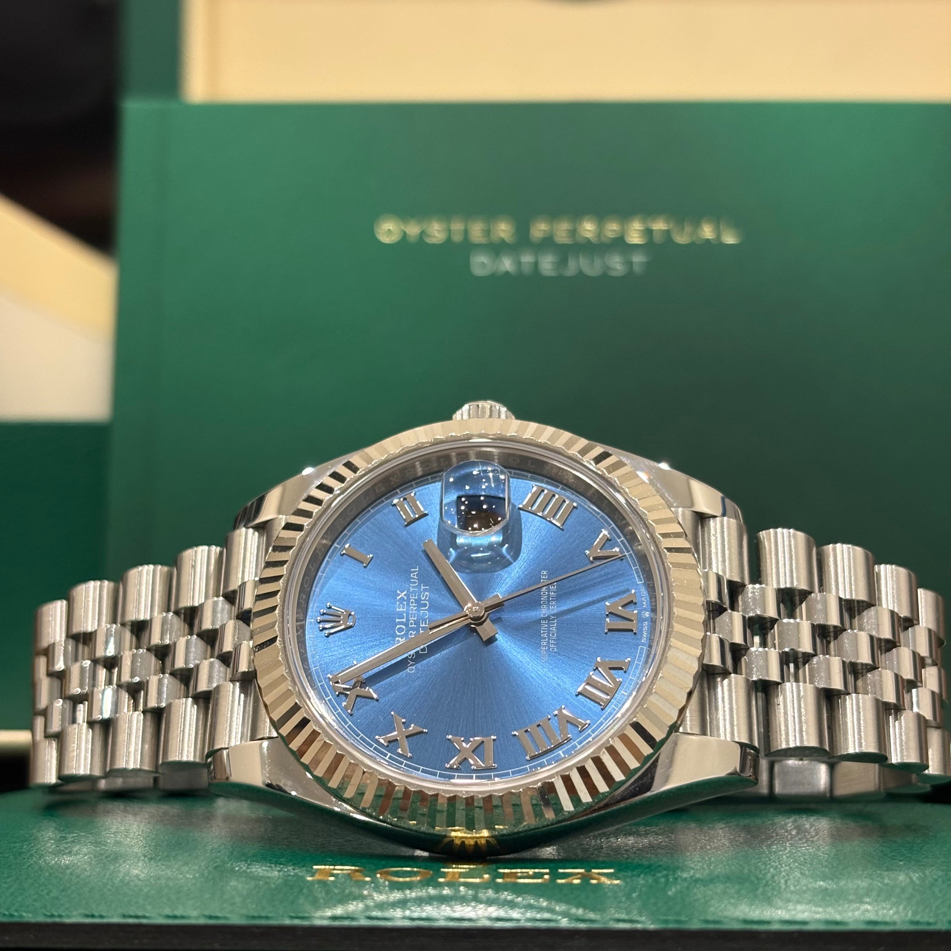 Rolex Datejust 41 126334 sunburst blue dial angled close up showing the winding crown