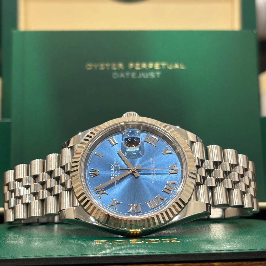 Rolex Datejust 41 Azzurro blue Roman dial laid on its green Rolex wallet