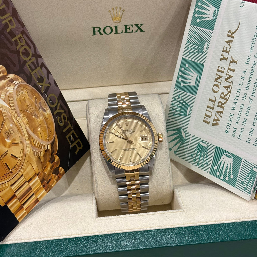 Rolex Datejust 36 champagne tapestry dial wide view with full one year warranty booklet