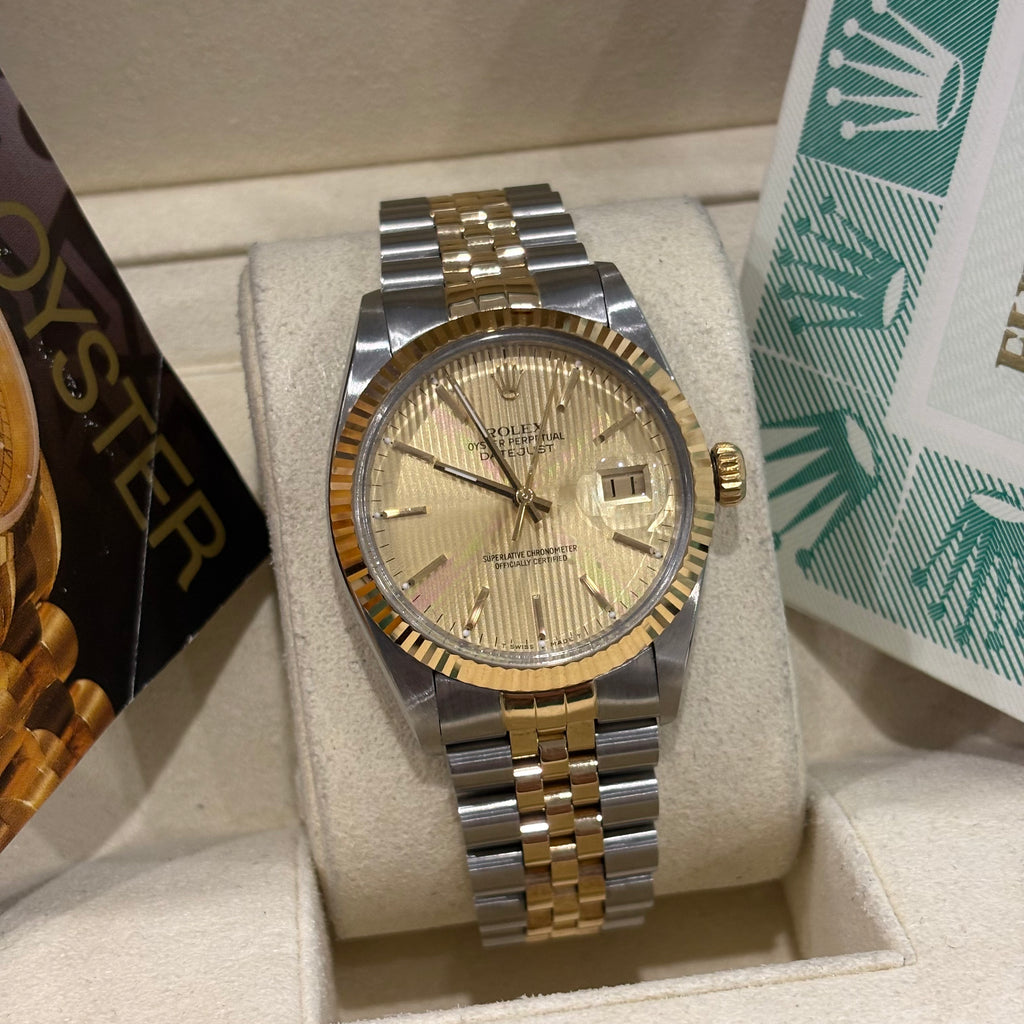 Rolex Datejust 36mm close view of the striped champagne tapestry dial and stick markers