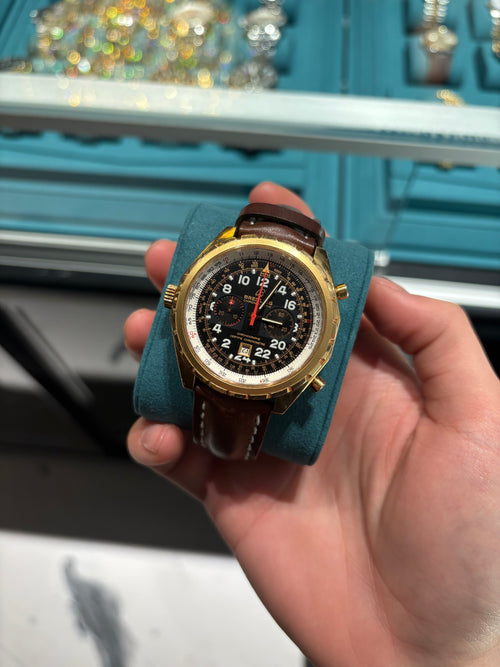 Breitling Navitimer Chronograph Yellow Gold Black Dial Brown Leather Strap at Adonia Jewellers in Yorkville, Toronto