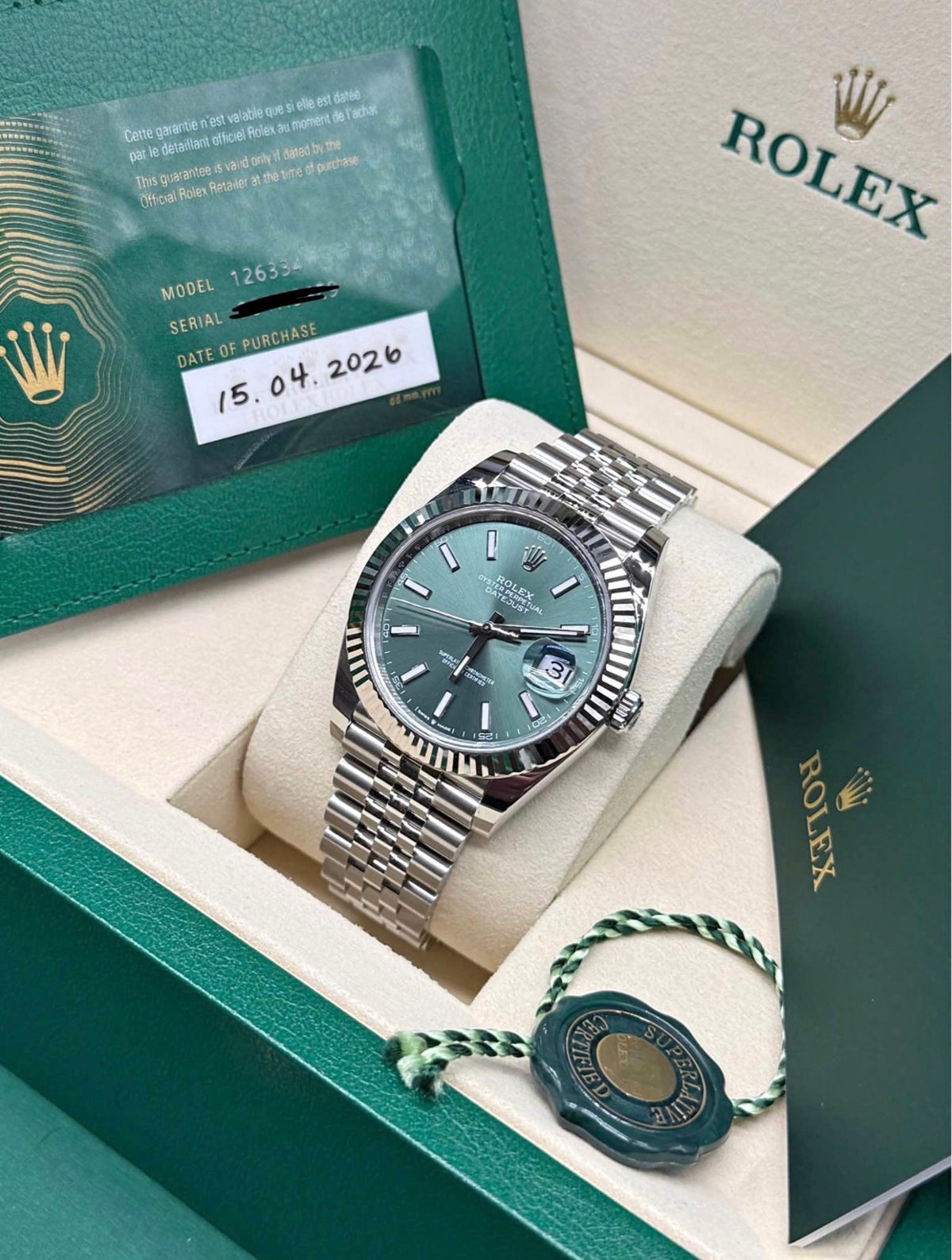 Rolex Datejust 41mm mint green dial with 2026 dated warranty card and green hang tag