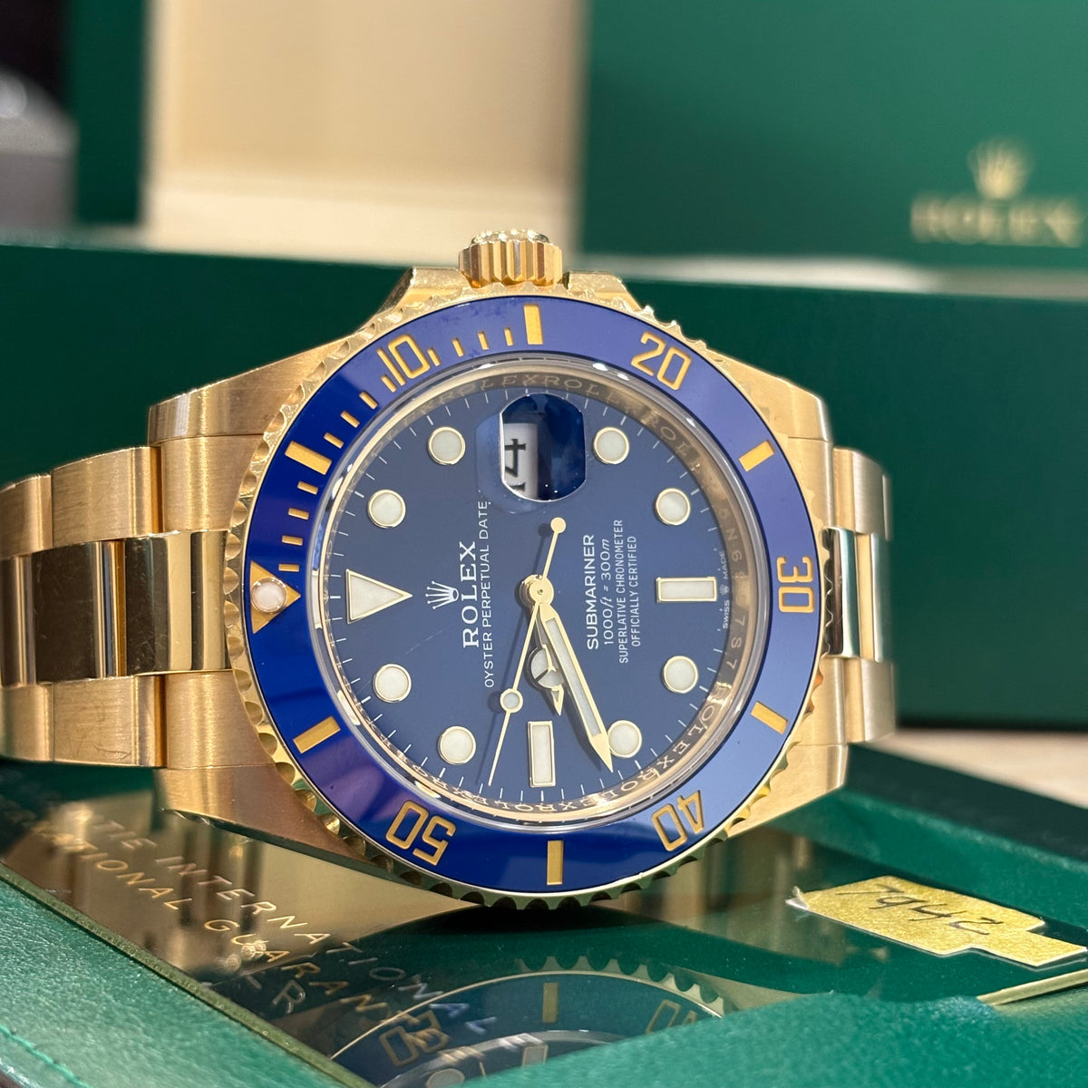 Rolex Submariner Bluesy 126618LB front view of the royal blue dial with luminous hour markers and date Cyclops
