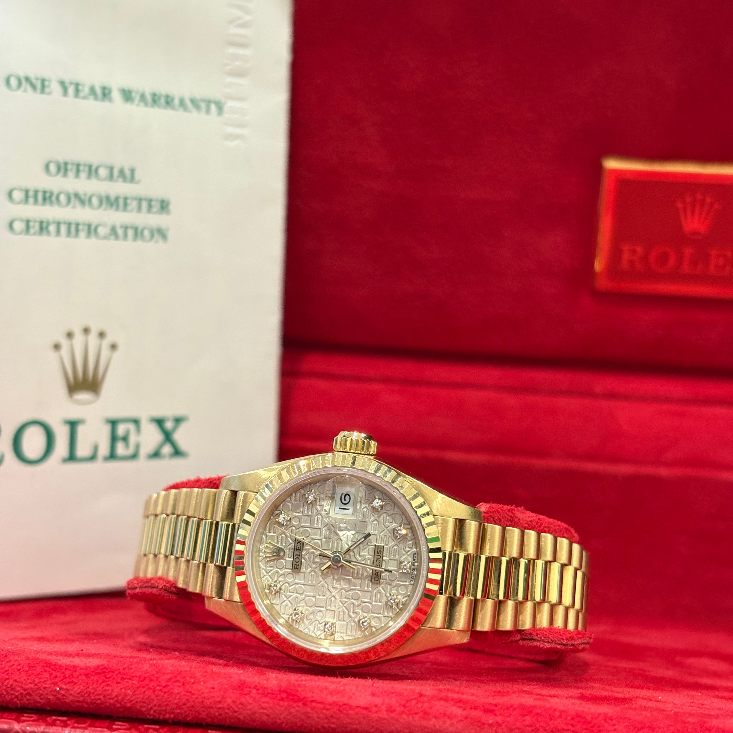 Rolex Lady Datejust 26mm 18K yellow gold diamond dial wide view in front of its vintage red Rolex box